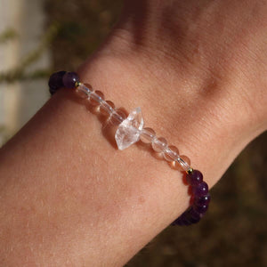 Handcrafted amethyst, quartz, and Herkimer diamond gemstone bracelet on wrist, 17cm, showcasing elegant design and natural stones.
