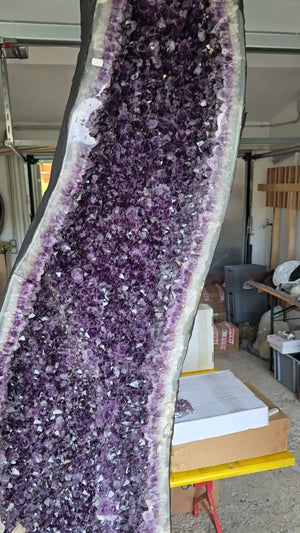 Large open Amethyst geode displaying deep purple crystals, ideal for enhancing luxury and wellness spaces