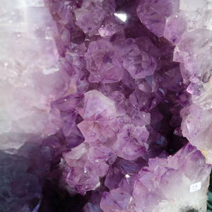 Close-up of Amethyst Druse Unique Piece No. 19 with vibrant purple crystals, promoting harmony and relaxation for home decor.