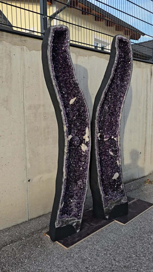 Large AA-quality amethyst geode pair with deep purple crystals, ideal for luxury interiors and therapy rooms.