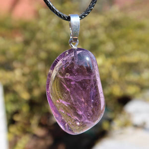 Ametrin pendant with silver bail, showcasing unique violet-golden hues, 35mm. Features natural gemstone for harmony and creativity.