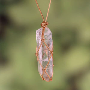 Handcrafted Bergkristall pendant with adjustable macrame necklace, unique design, showcasing natural crystal beauty.