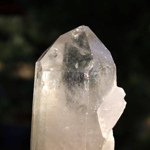Clear quartz crystal point with polished facets, 13x5 cm, from Brazil, ideal for clarity and meditation.