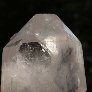Polished Bergkristall quartz crystal point from Brazil, showcasing sparkling faceted surfaces, ideal for clarity and meditation.