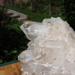 Raw Brazilian crystal cluster with large clear points on display, highlighting natural beauty and unique formations for clarity and focus.