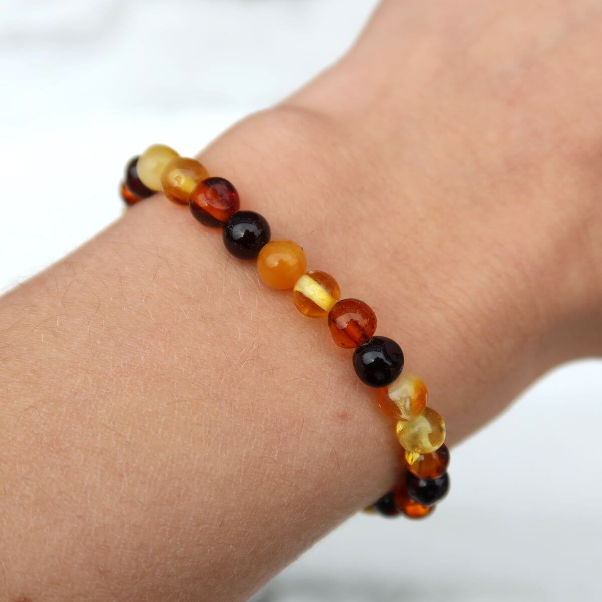 Multicolor Baltic amber bracelet showcasing warm golden hues, designed with lightweight beads for a stylish and comfortable wear.