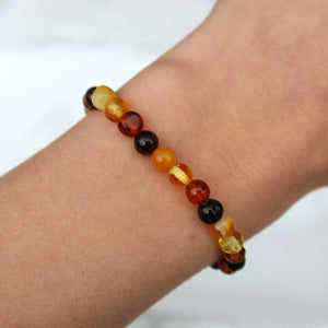 Multicolor Baltic amber bracelet showcasing warm golden hues, designed with lightweight beads for a stylish and comfortable wear.