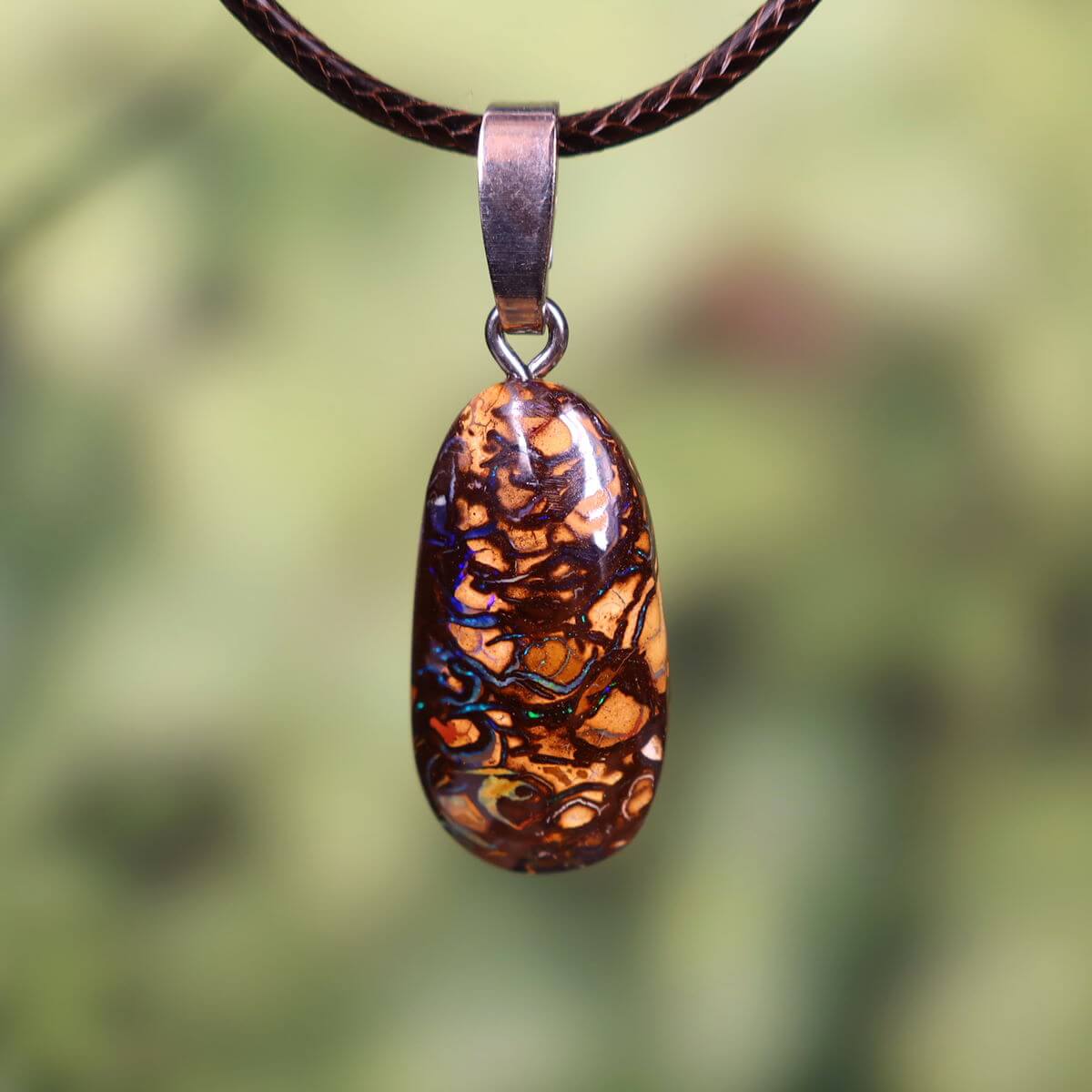 Boulder Opal pendant with unique patterns and rhodium-plated silver loop, handcrafted and polished, size 25x12mm.