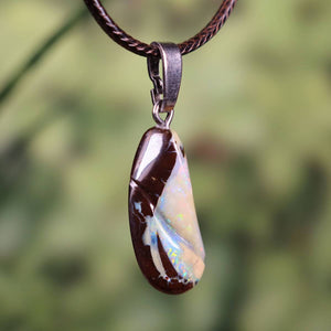 Boulder Opal pendant with rhodium-coated silver loop, showcasing unique hand-polished Australian gemstone, size 27x12mm.