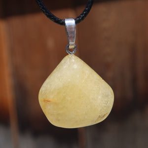 Yellow Danburite pendant on black necklace, showcasing its unique crystal clarity and sunny hue, ideal for fresh energy and joy.