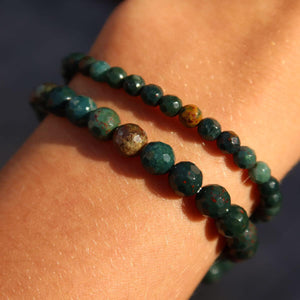 Faceted heliotrope gemstone bracelet featuring vibrant green and red hues, worn on a wrist, highlighting its healing properties.
