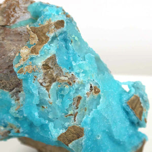 Raw Hemimorphite mineral displaying vibrant turquoise colors and natural crystal texture, measuring 11x8x5 cm, unique piece.