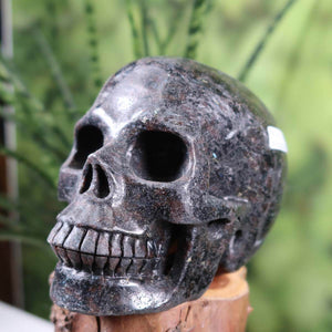 Handcrafted Anthophyllit crystal skull, 12x9 cm, unique natural stone Totenkopf from Steinwelten collection.