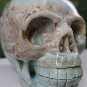 Handcrafted blue aragonite-calcite crystal skull, unique mineral collectors' piece, available at Steinwelten.