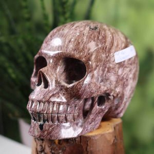 Handcrafted Charoit crystal skull sculpture, unique collector's piece, 12x9 cm, Kristallschädel online kaufen.