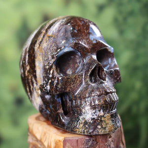 Handcrafted natural stone crystal skull, unique 12x9 cm design. Buy Kristallschädel online featuring real gemstone Totenkopf.