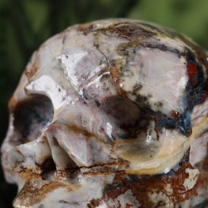 Handcrafted XL crystal skull from natural stone featuring unique patterns, collectible item from Steinwelten available online.