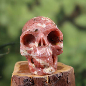 Handcrafted crystal skull made from natural stone with unique patterns, 7x6 cm, product number 386, collector's item.