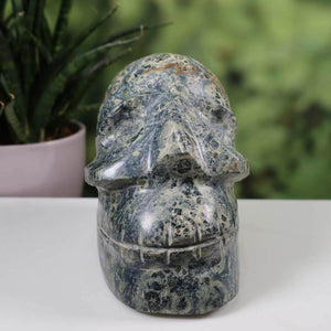 Handcrafted Eldarit Kabamba crystal skull on display, featuring unique design. Genuine mineral collectible from Graz.