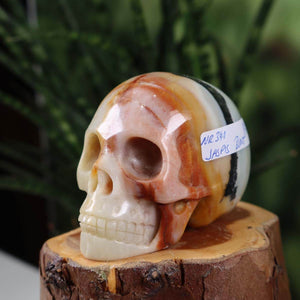 Handcrafted jasper crystal skull on wood base, 7x6 cm, unique energy masterpiece. Buy online at Steinwelten.