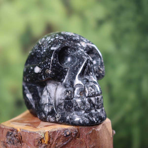 Handcrafted sedimentary stone crystal skull, 8x6 cm, unique artisan gemstone sculpture.