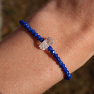 Handmade lapislazuli bracelet with Herkimer diamond on wrist, featuring deep blue faceted beads, 17cm length.