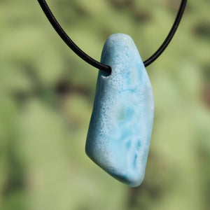 Larimar pendant 45mm, uniquely drilled, showcasing natural beauty and style, from the Dominican Republic, on necklace.