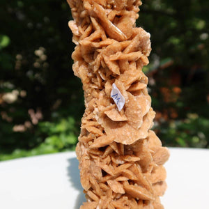 Close-up of a unique Moroccan sand rose crystal formation outdoors.