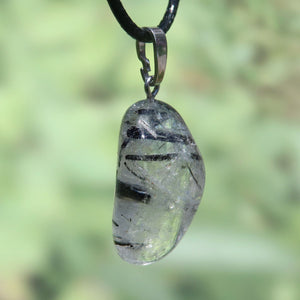 Unique Turmalinquarz pendant featuring a blend of clear quartz and black tourmaline, offering focus and protection, Unikat Nr. 14.