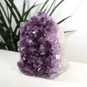 Uruguay Amethyst Mini Geode in deep purple, 10x13cm, showcasing intense sparkle and natural crystal formation. Ideal for harmony.