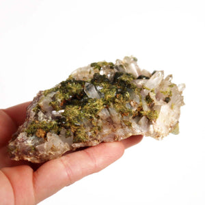 Hand holding Epidot Quartz Crystal with clear Bergkristall tips, natural raw mineral from Morocco for collectors. Perfect clarity.