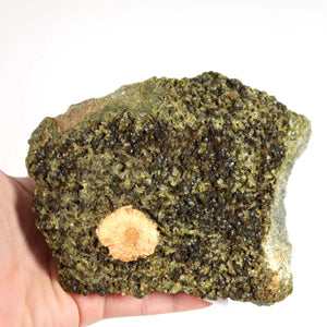 Hand holding Epidot and Prehnit mineral specimen from Morocco, showcasing natural texture and unique beauty.